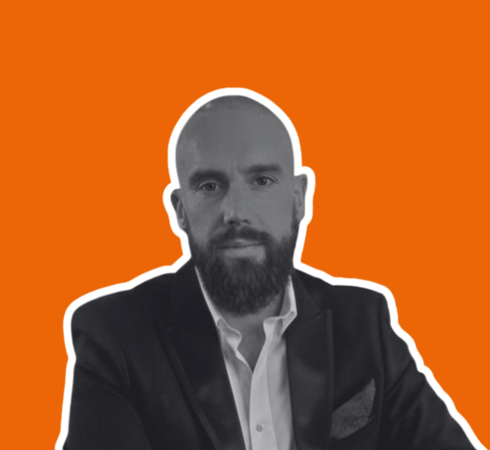 Headshot of Jim Bennett on orange background