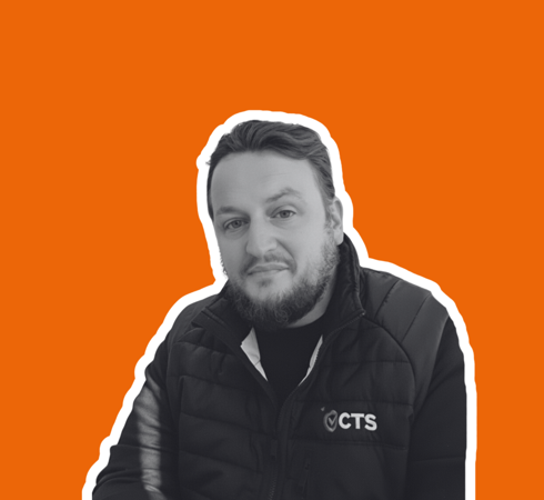 Headshot of Lee Morris on orange background