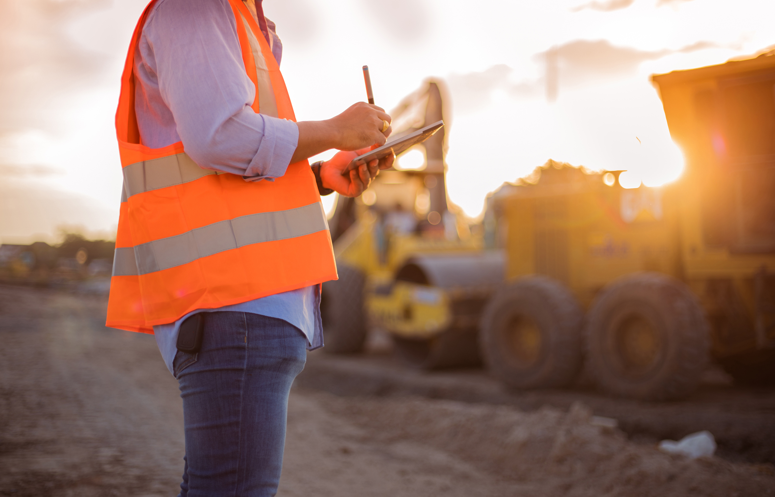 A construction worker making notes