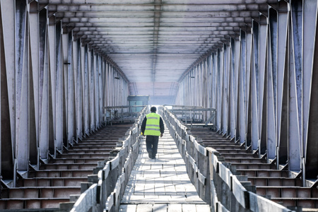 Bridge Inspection on Construction Site with Work in Hi Vis