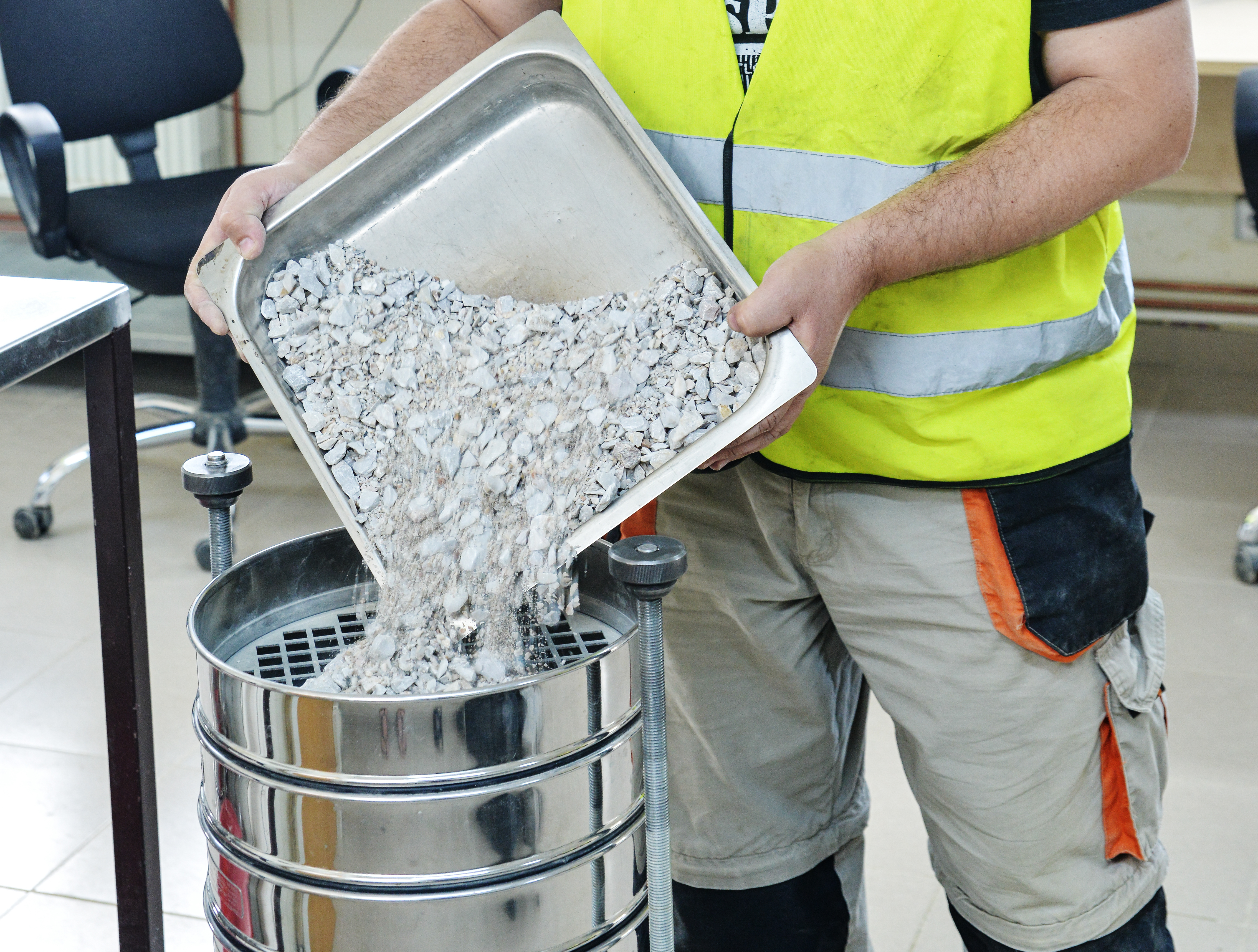 Sifting concrete, part of the aggregate testing process