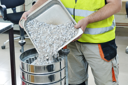 Sifting concrete, part of the aggregate testing process
