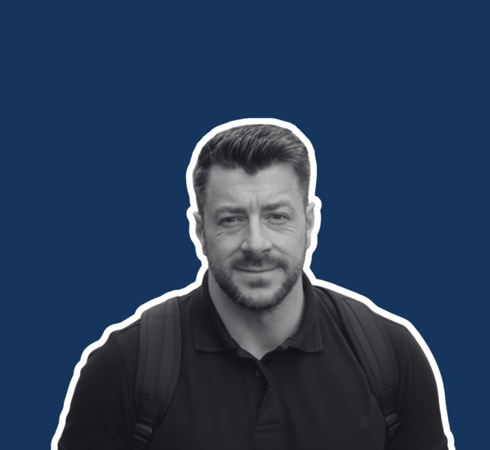 Headshot of Matt Mills on blue background